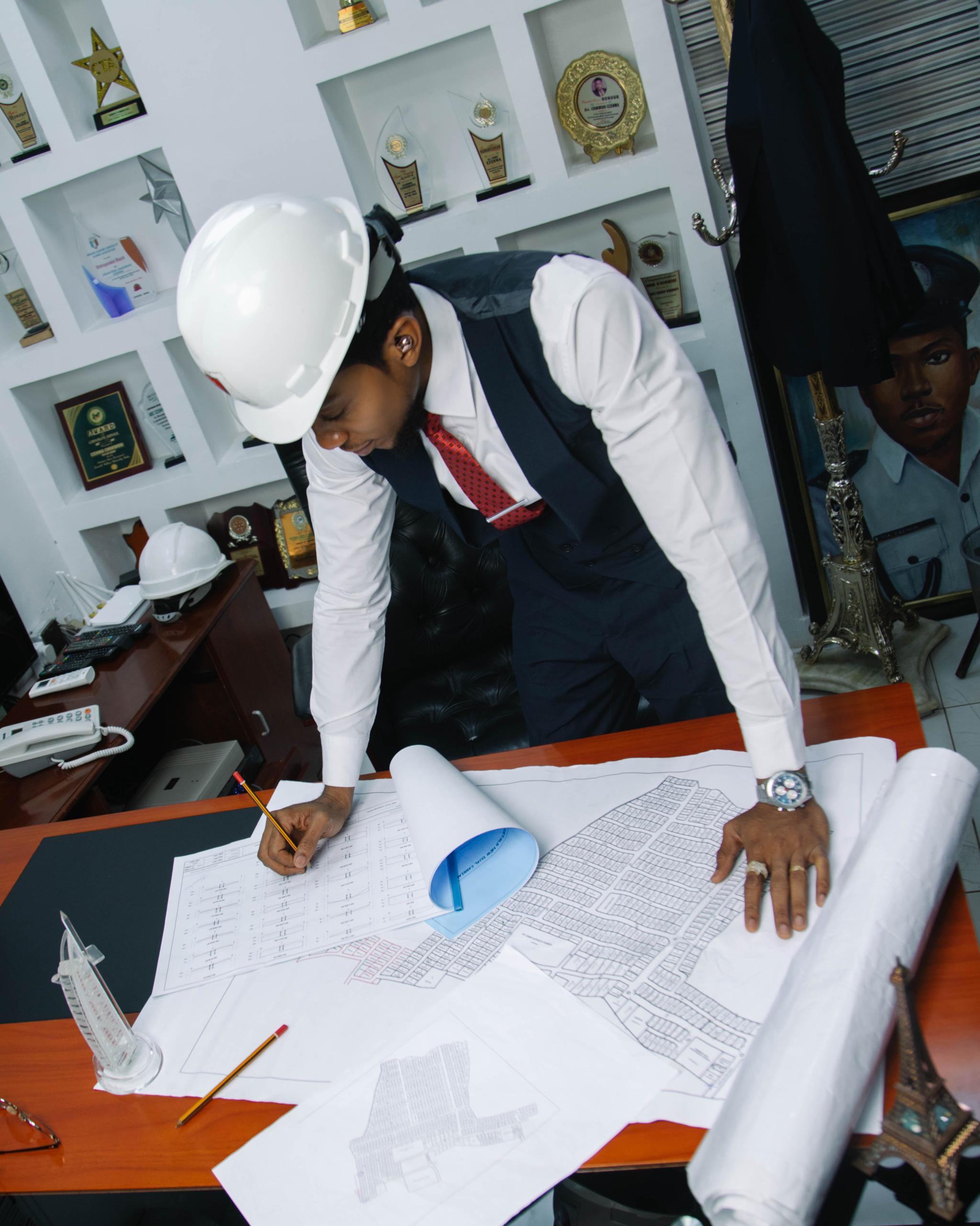 Working on blueprints at desk