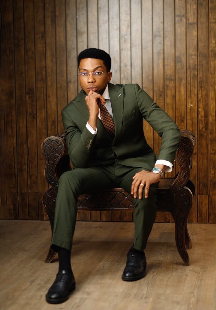 Seated portrait in green suit